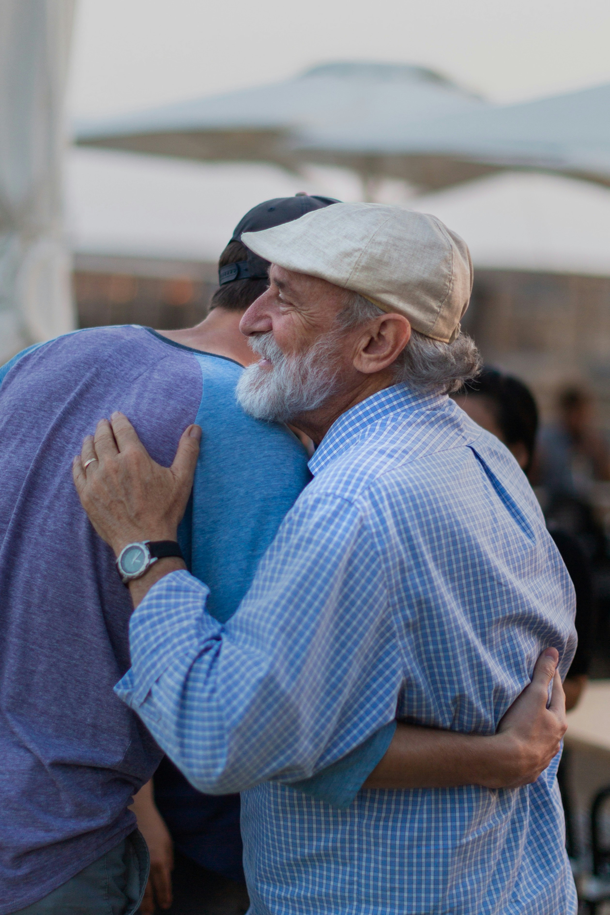 Father and son embracing